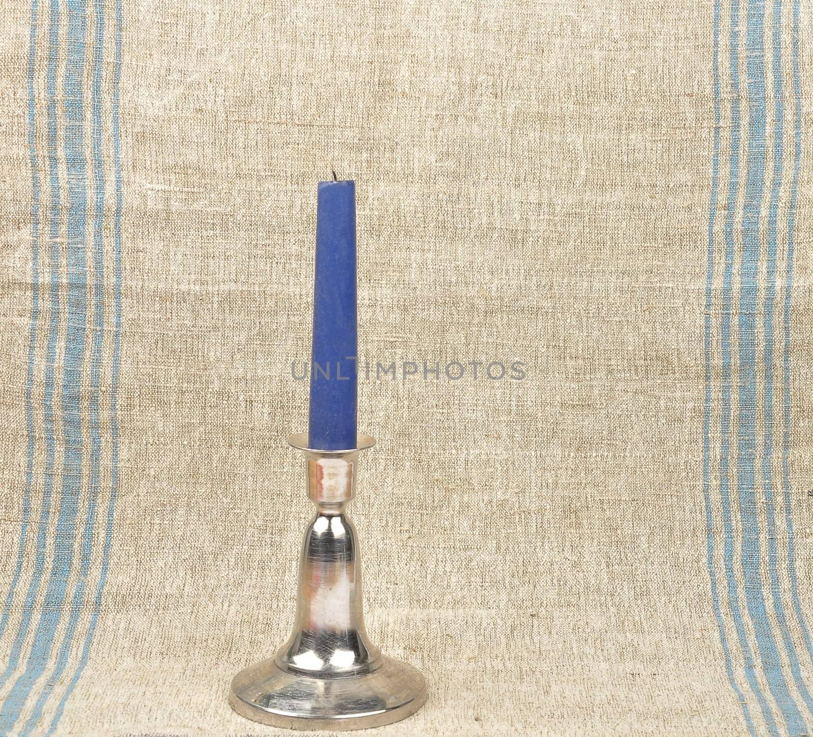 Candlestick on linen background