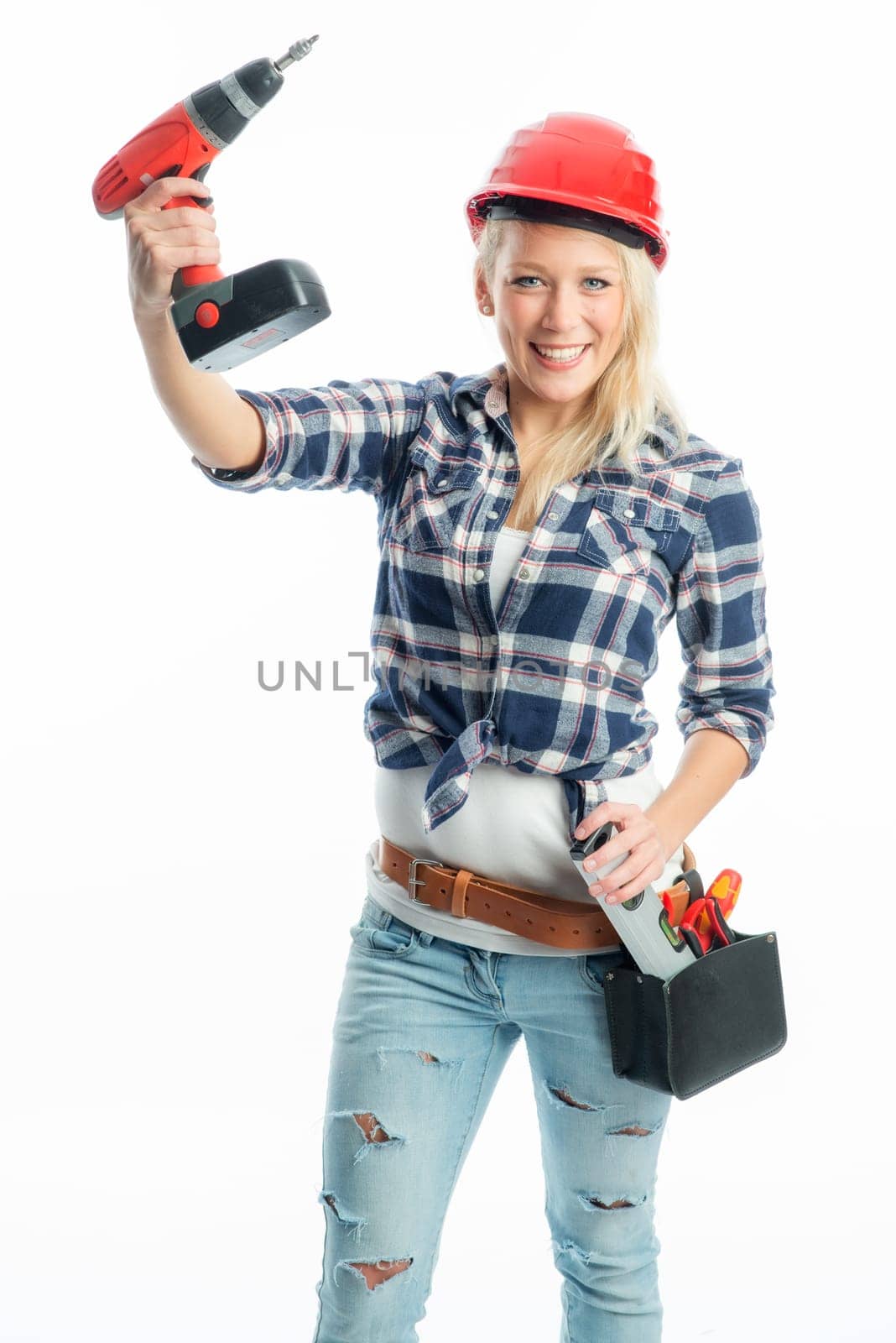 Female craftsman with cordless screwdriver and drill