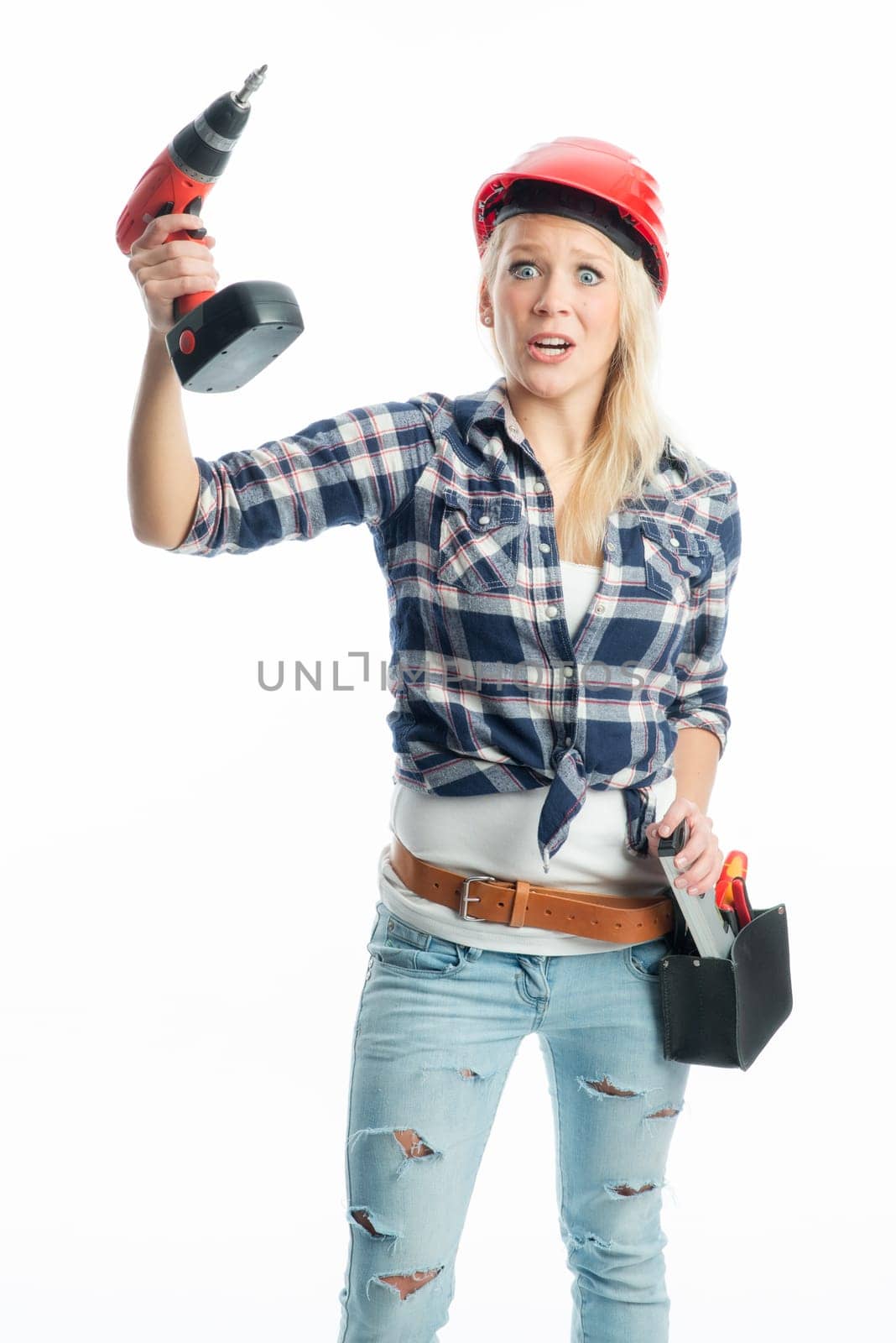 Female craftsman with cordless screwdriver and drill