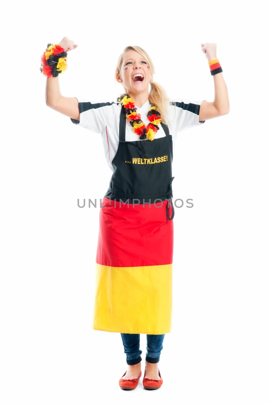 Jubilant blonde football fan with fan apron