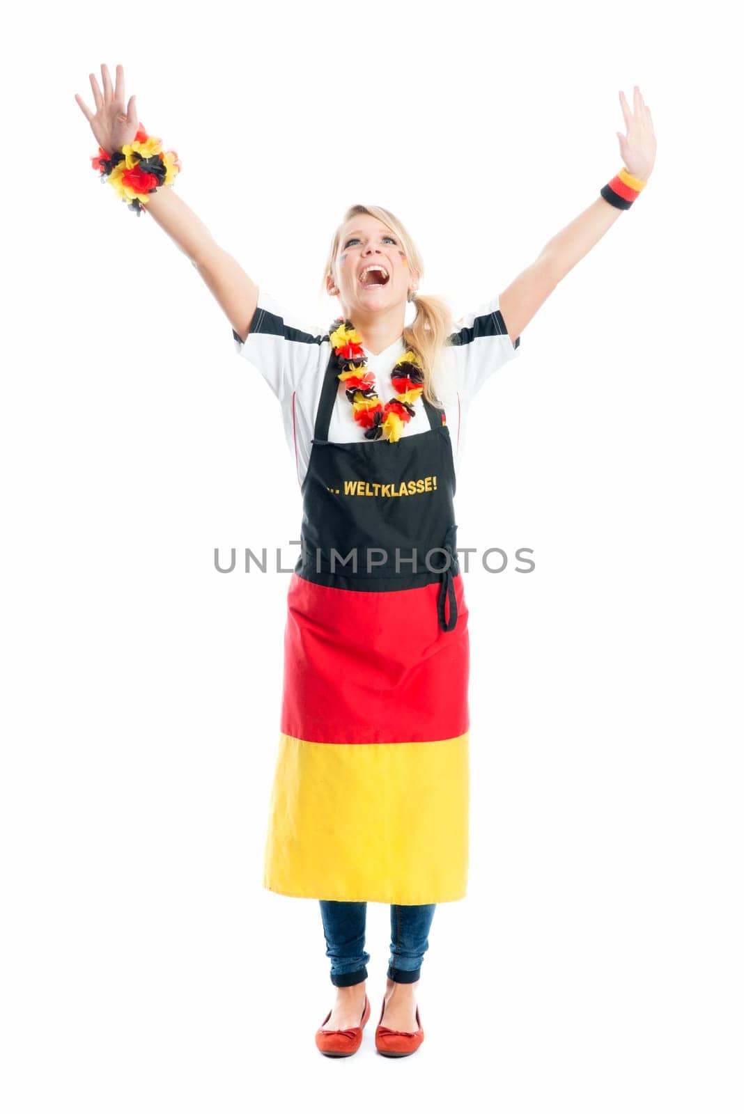 Jubilant blonde football fan with fan apron