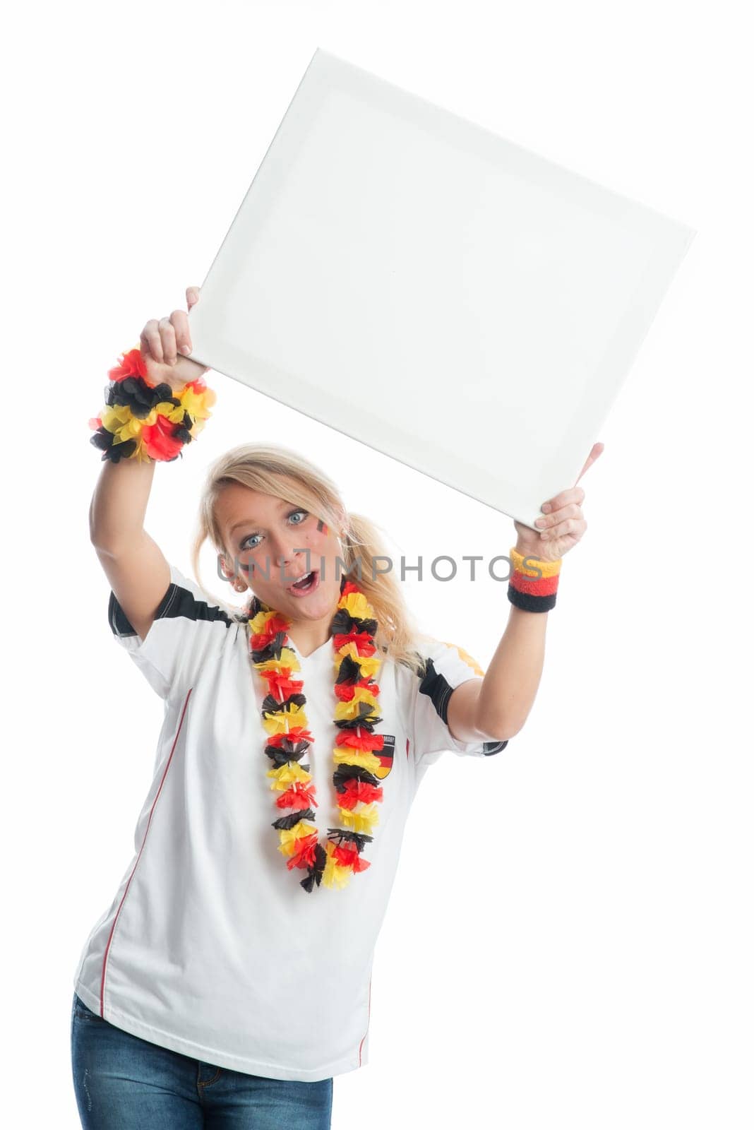 Blonde football fan holds a poster