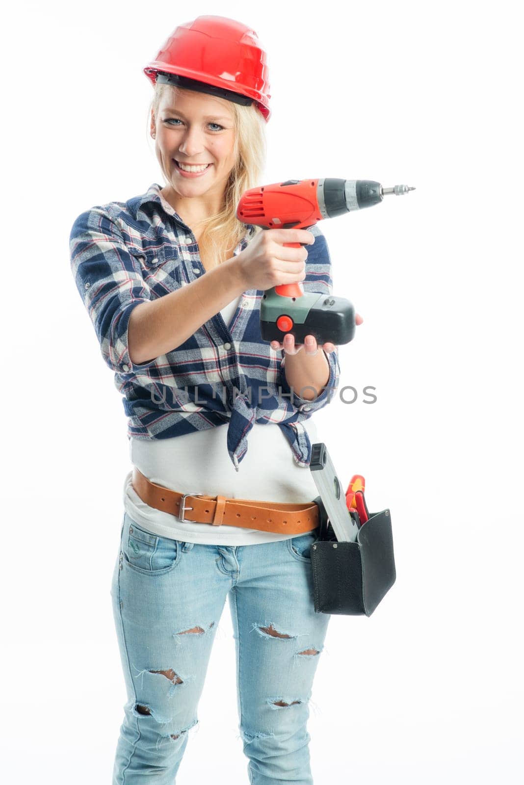 Female craftsman with cordless screwdriver and drill