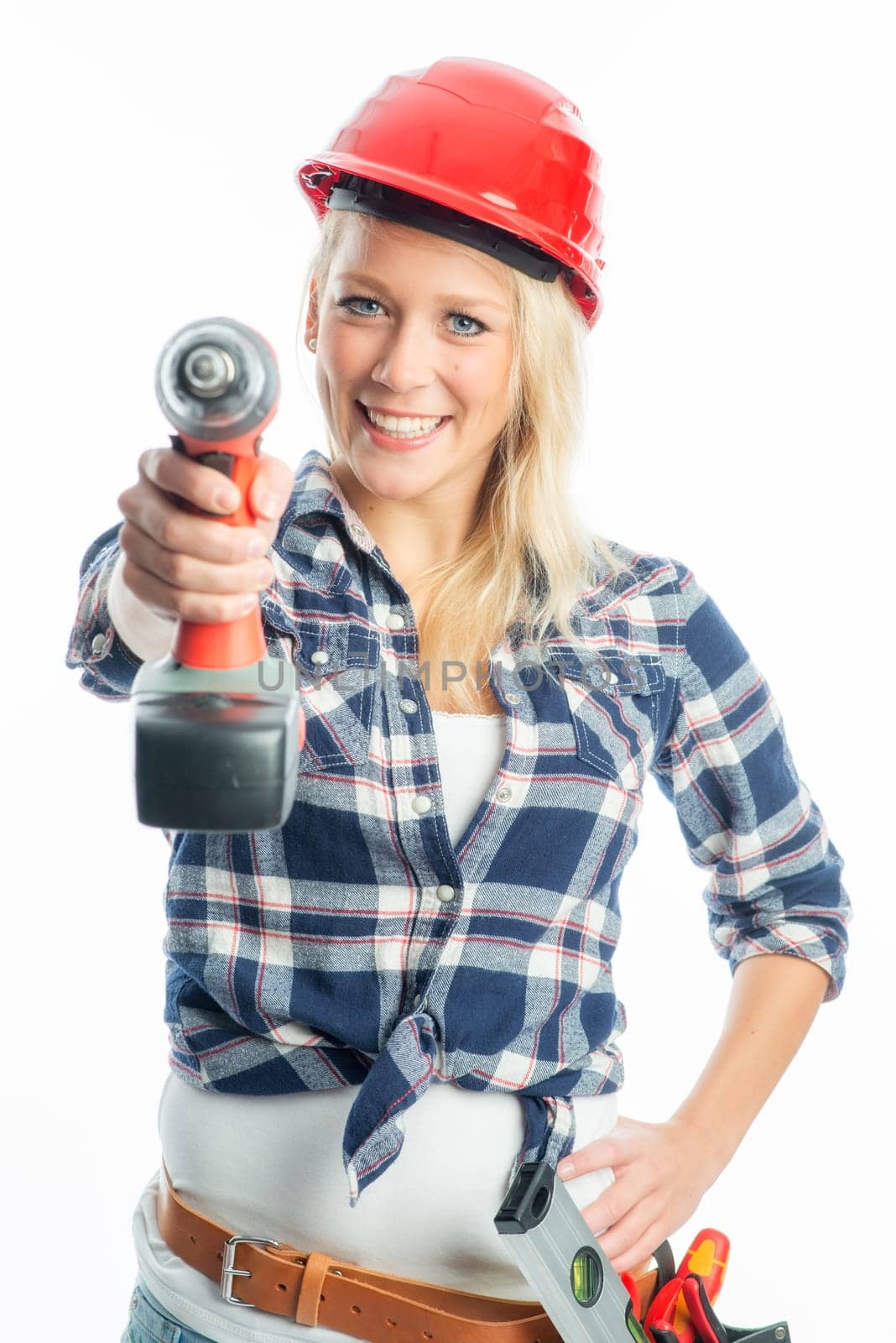 Female craftsman with cordless screwdriver and drill
