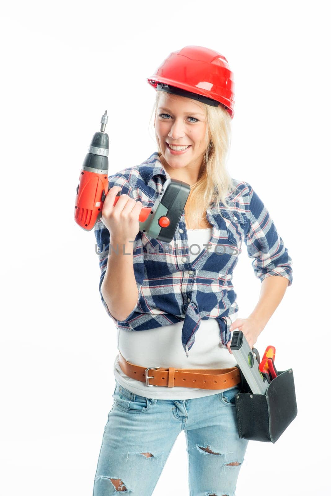 Female craftsman with cordless screwdriver and drill