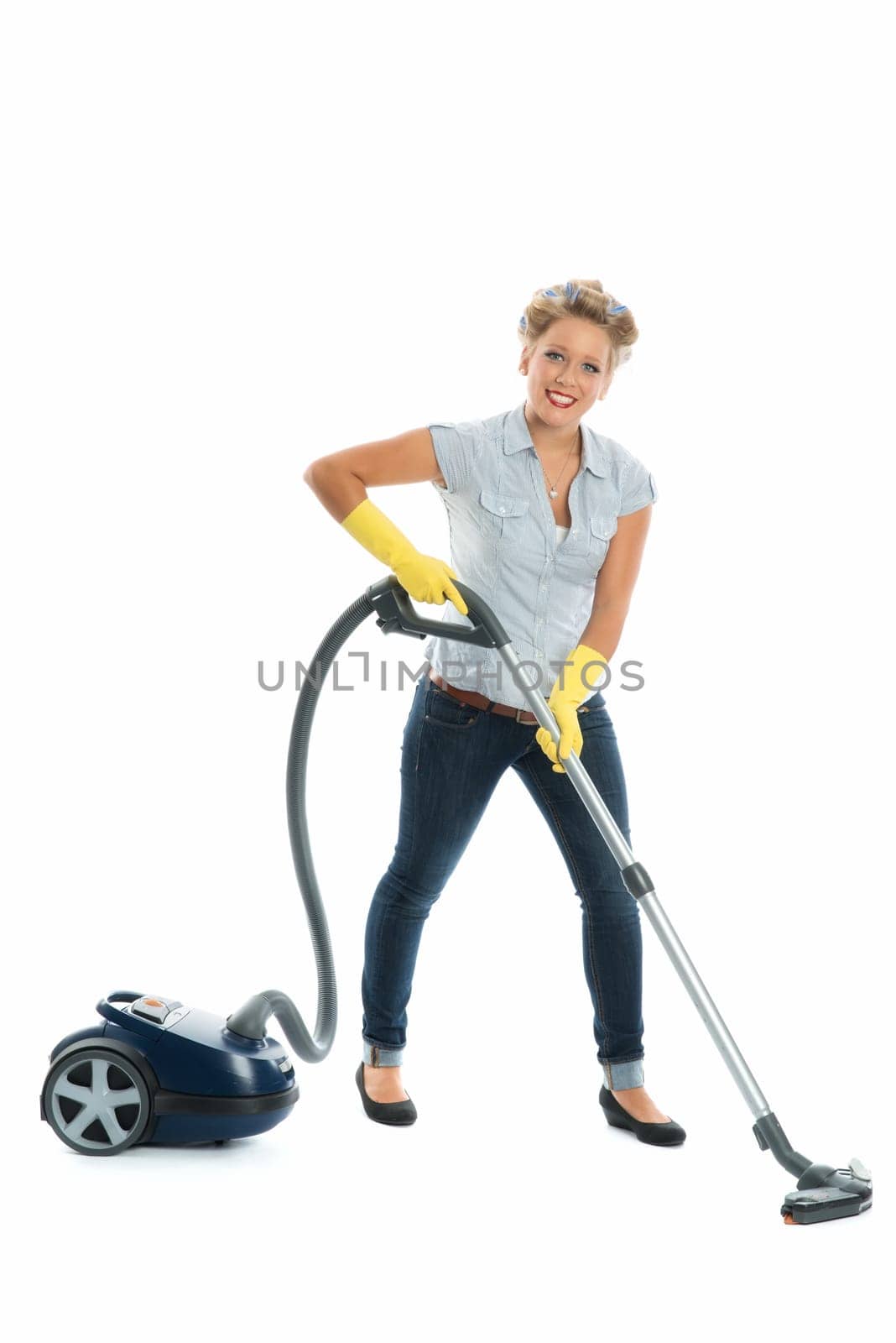 Housewife with vacuum cleaner
