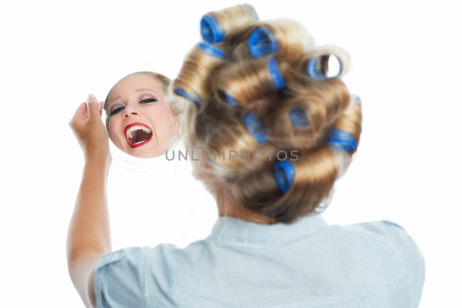 Housewife looks in the mirror