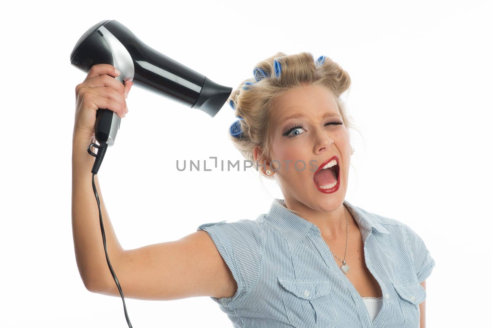 Woman blow-drys hair