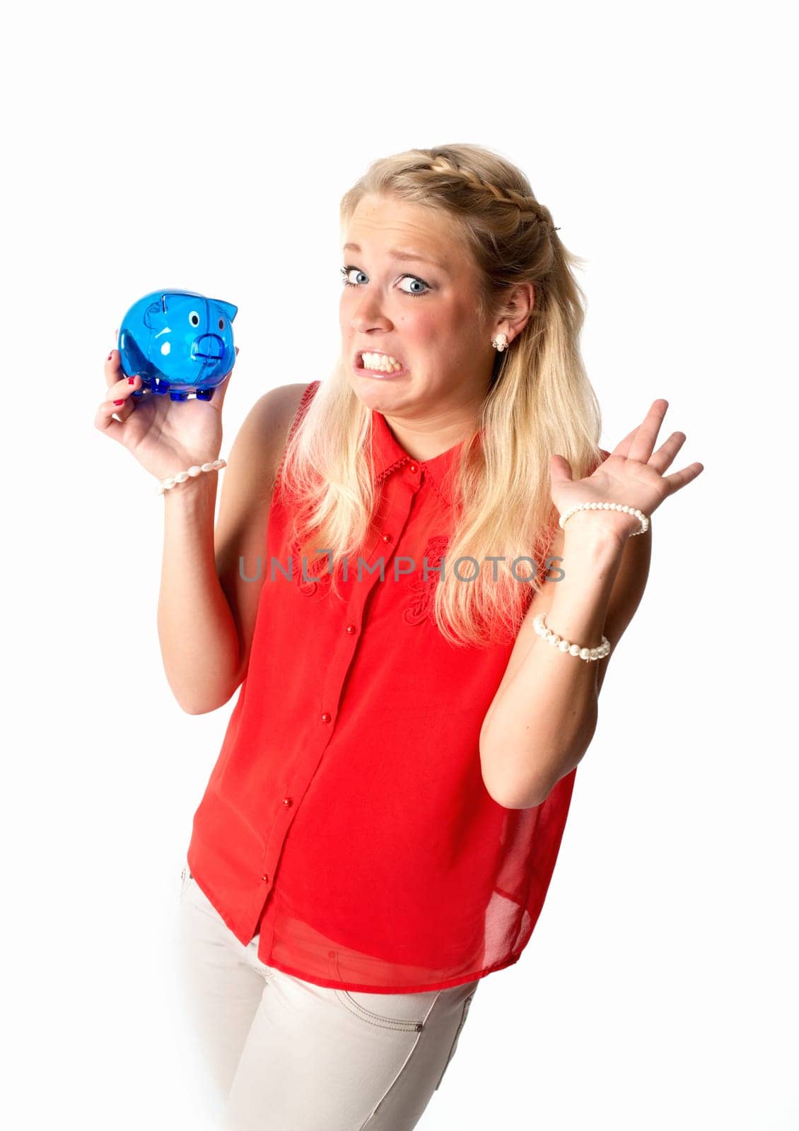 Blonde woman with piggy bank