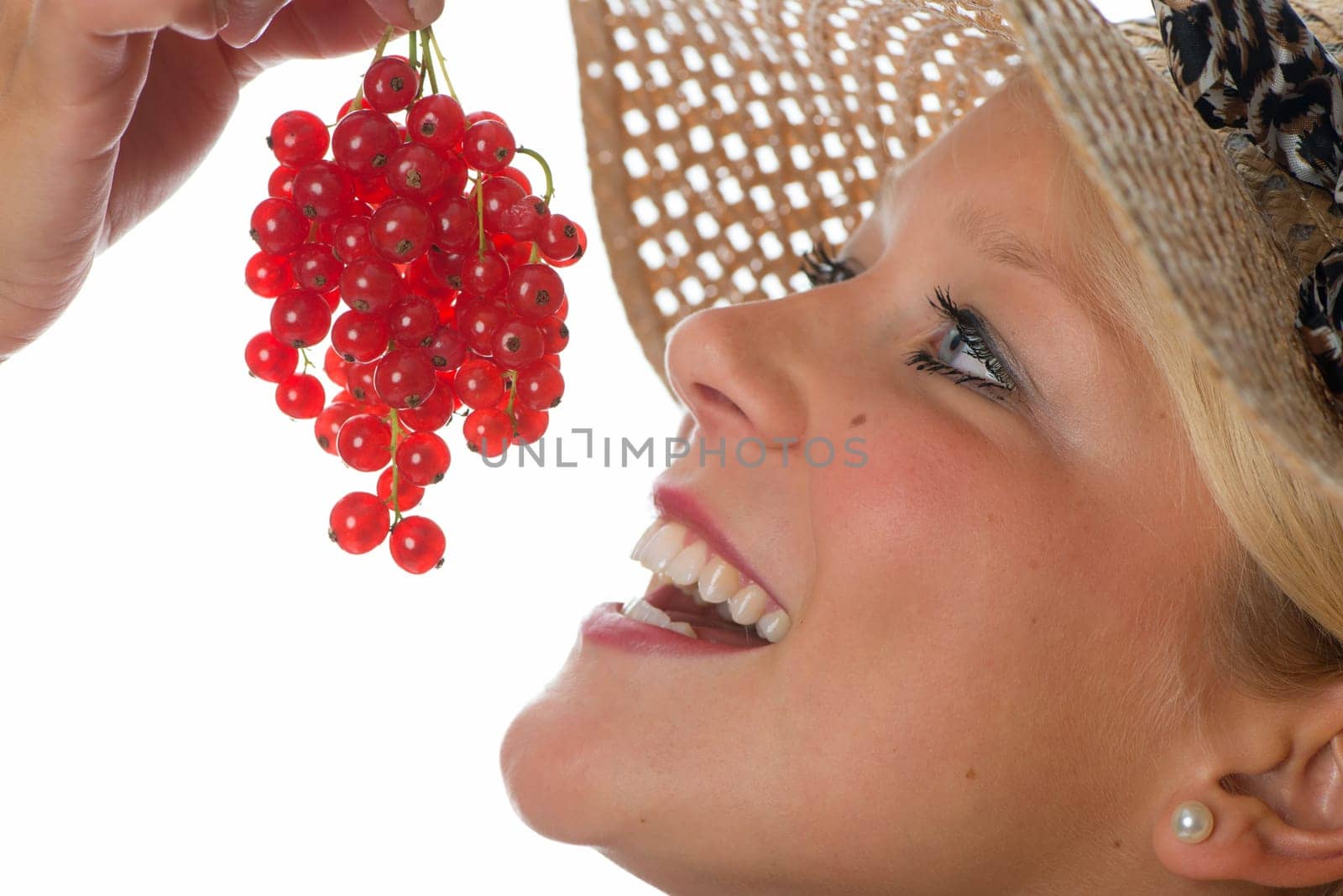 Blonde woman with currants