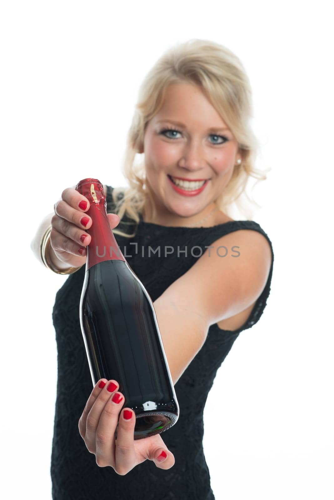 Woman holds red wine bottle