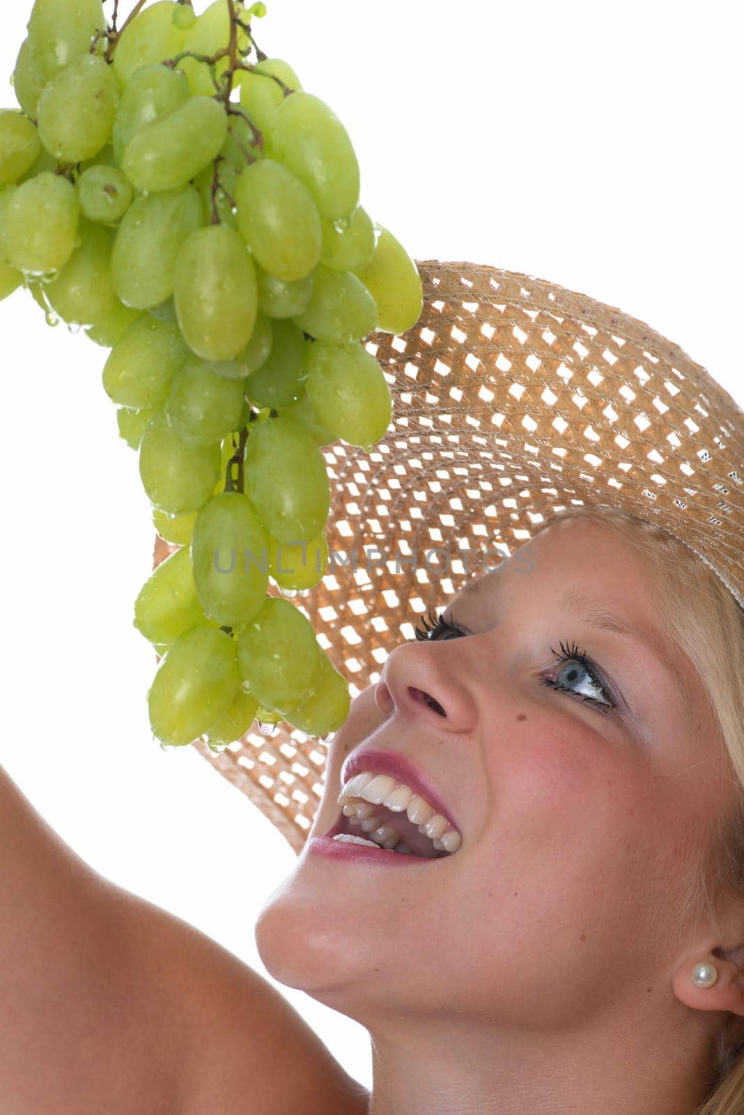 Blonde woman with grapes