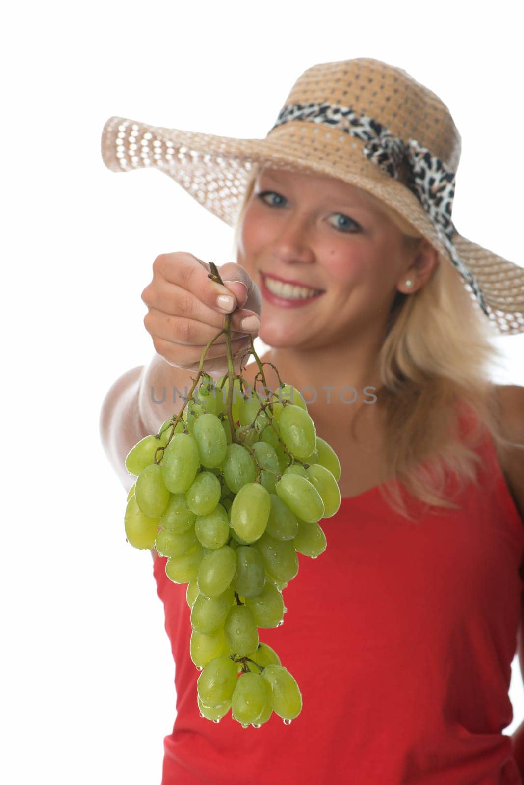 Blonde woman with grapes