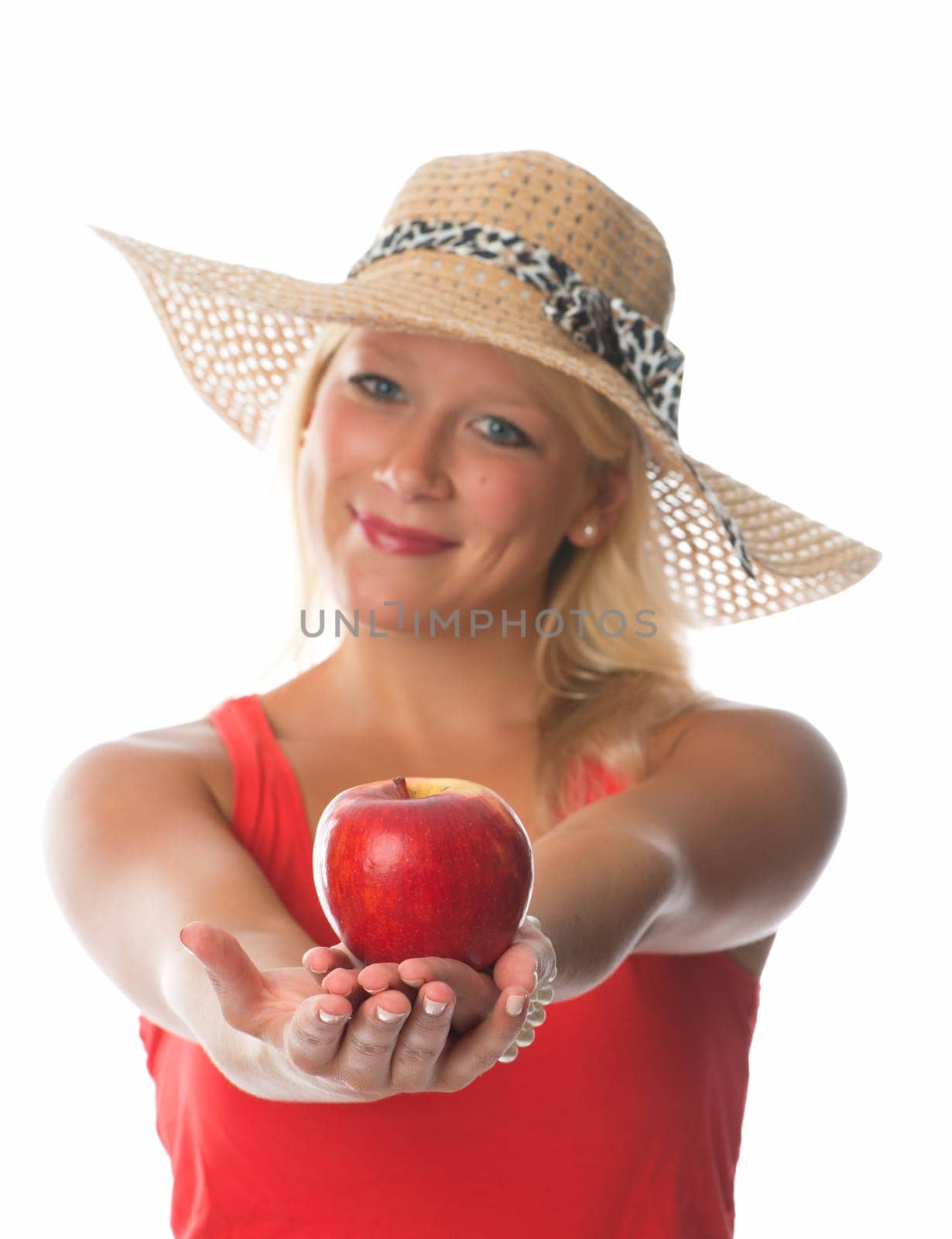 Blonde woman holds a red apple
