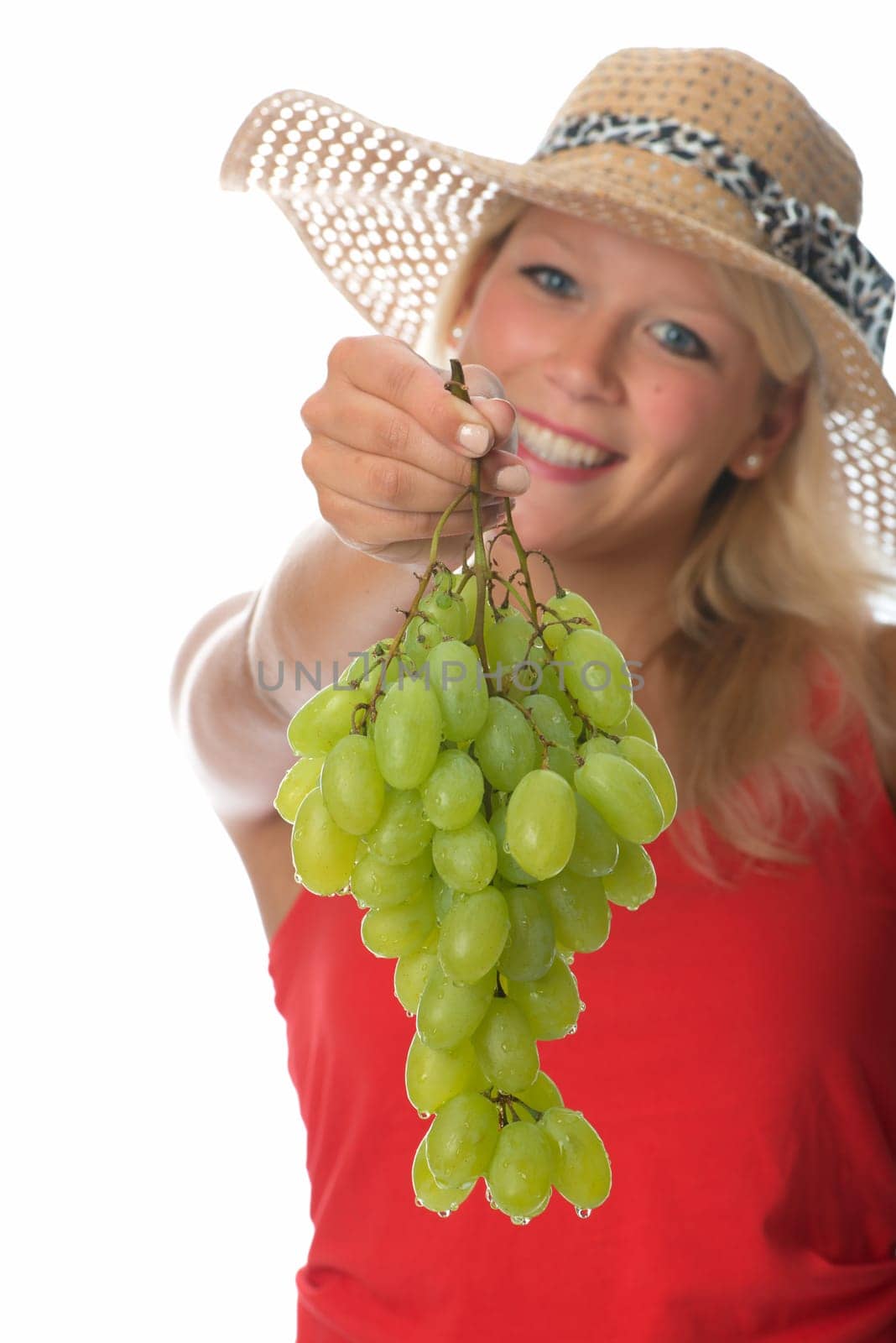 Blonde woman with grapes