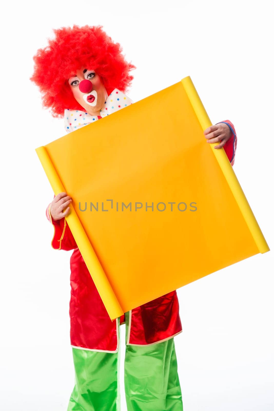 Clown holds advertising sign