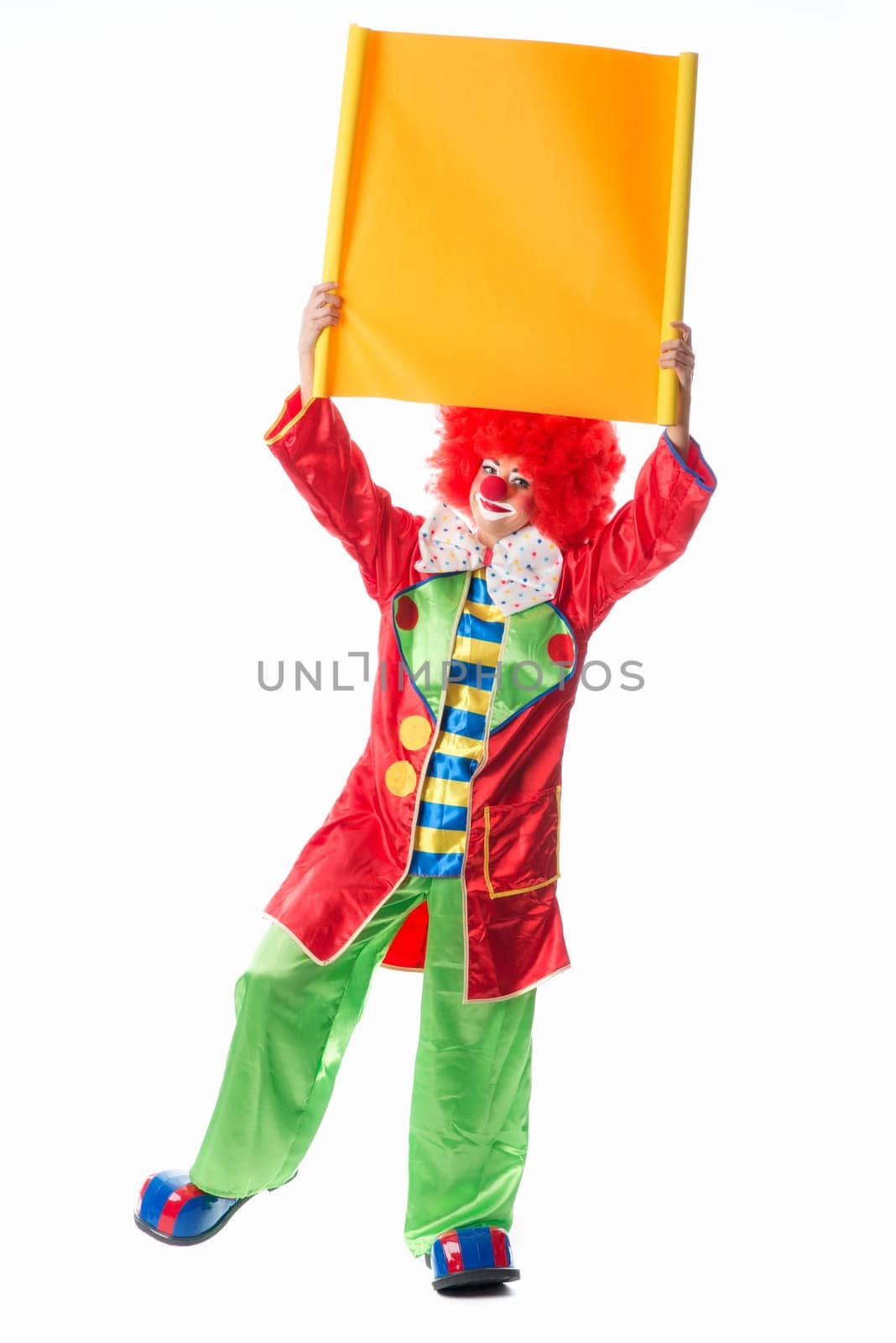Clown holds advertising sign