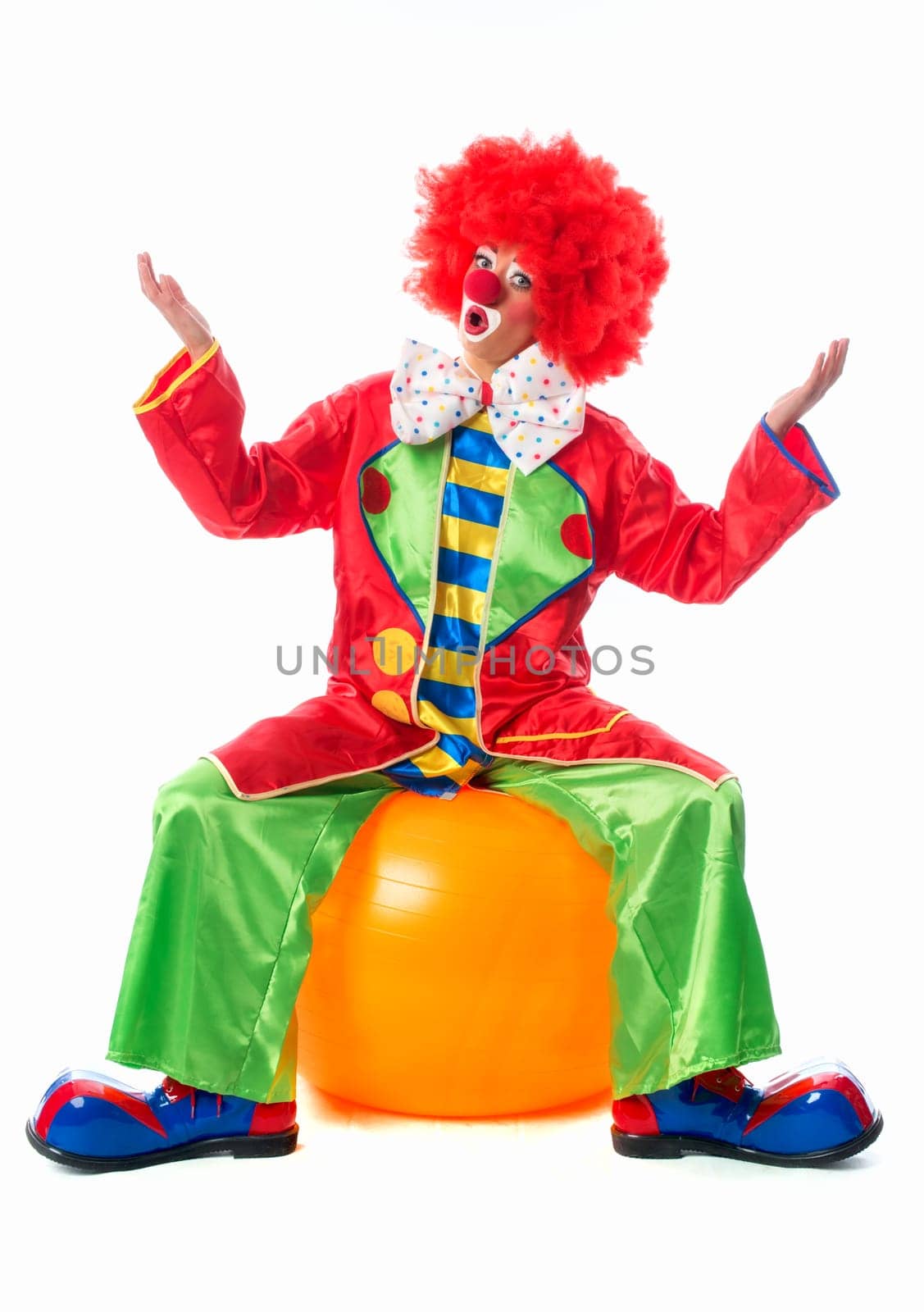 Clown sits on gymnastics ball