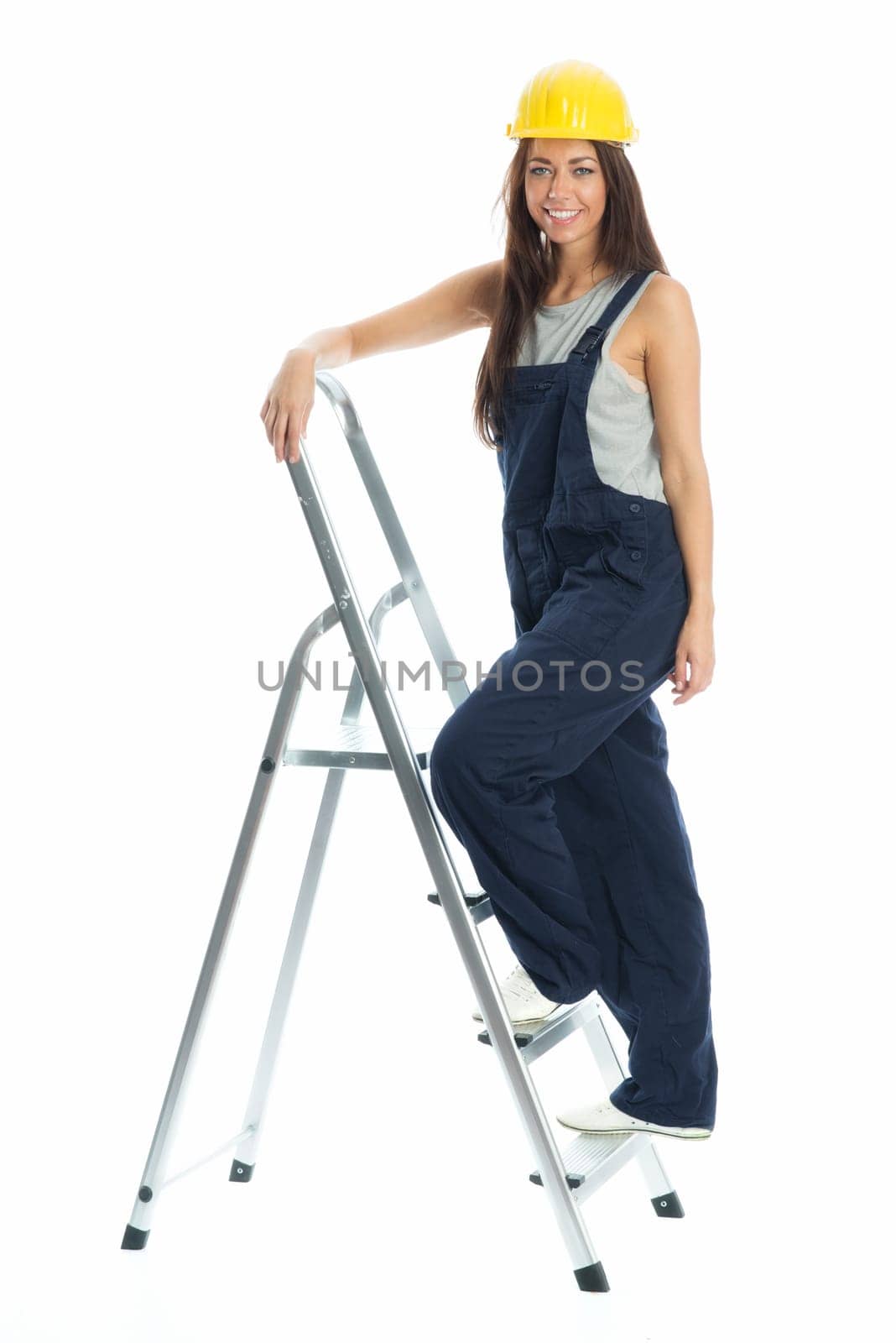 Female craftsman on step ladder