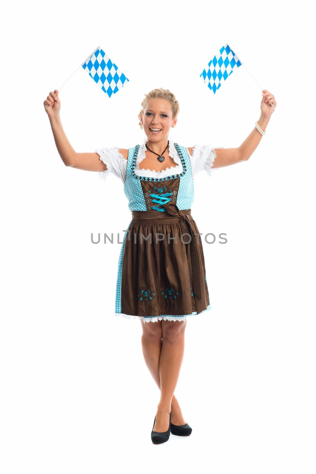 Bavarian girl waves with flags