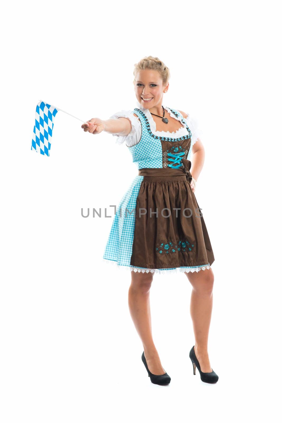 Bavarian girl waves with flags