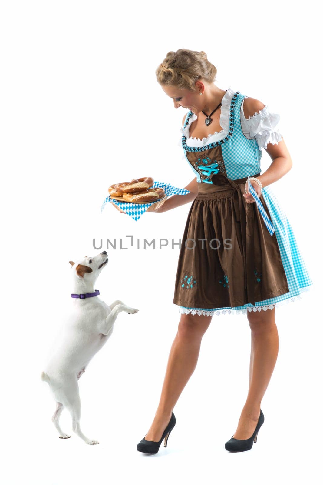 Bavarian woman with pretzels and dog