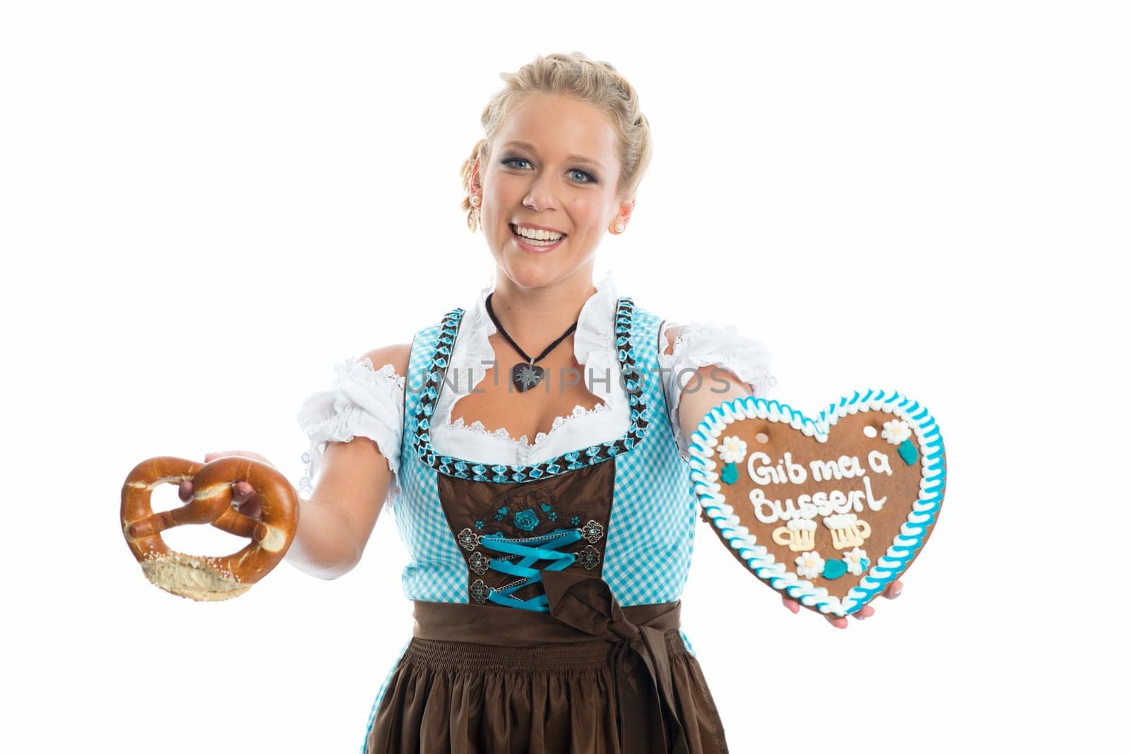 Bavarian girl with gingerbread heart and Brezn