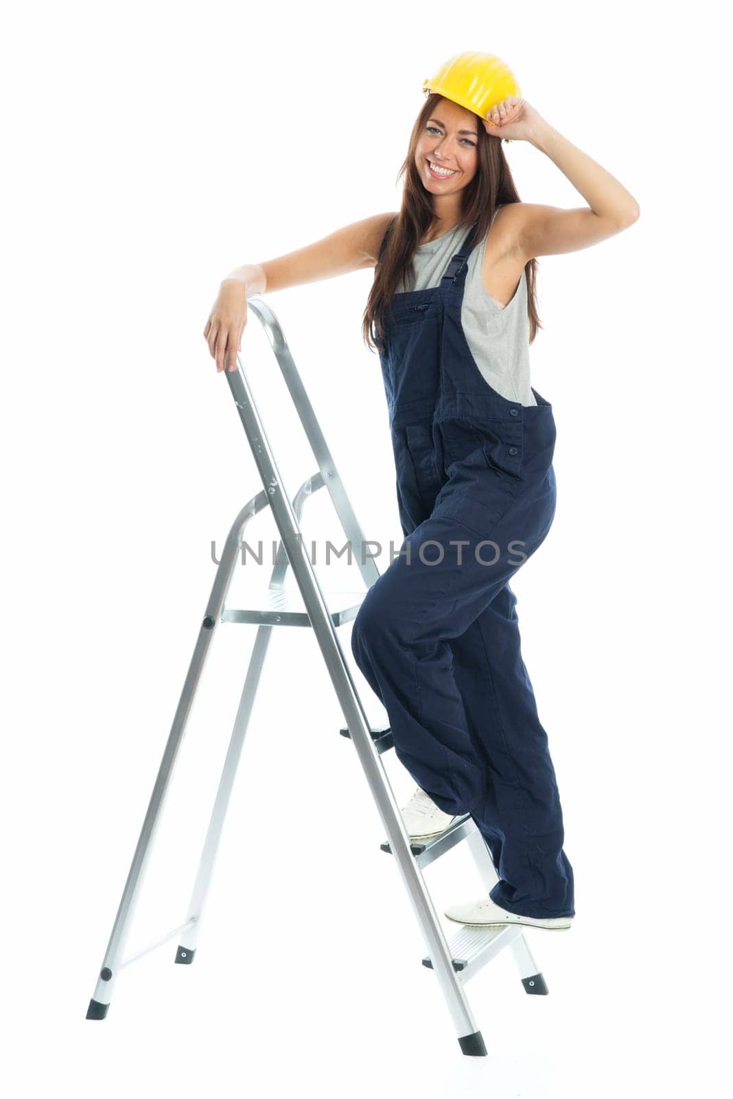 Female craftsman on step ladder