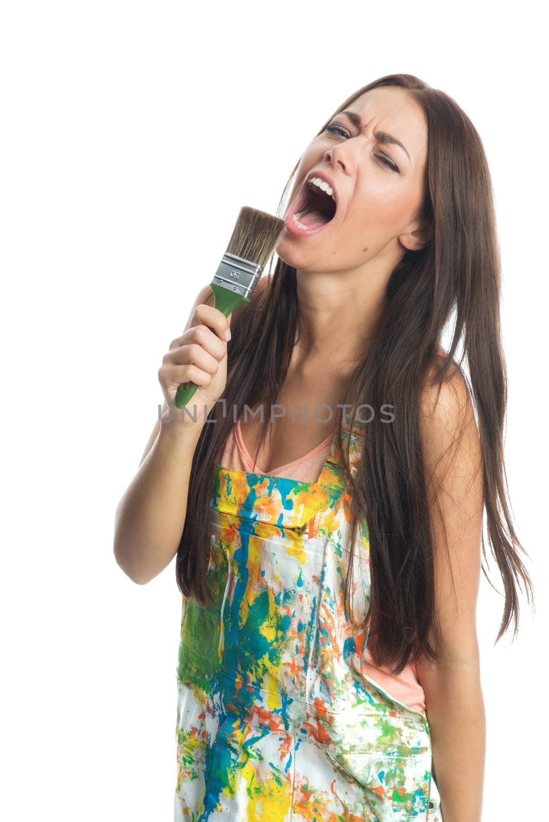 Woman with painter's brush sings