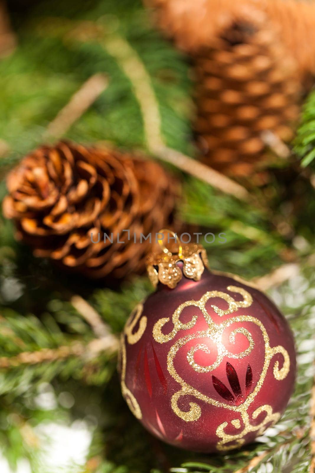 red Christmas tree ornament sembrightly decoration for Christmas with golden ornaments as macro detail