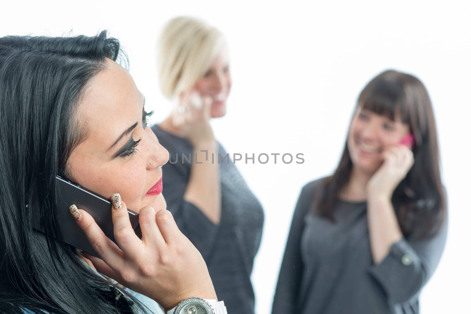 Three girls with smartphone
