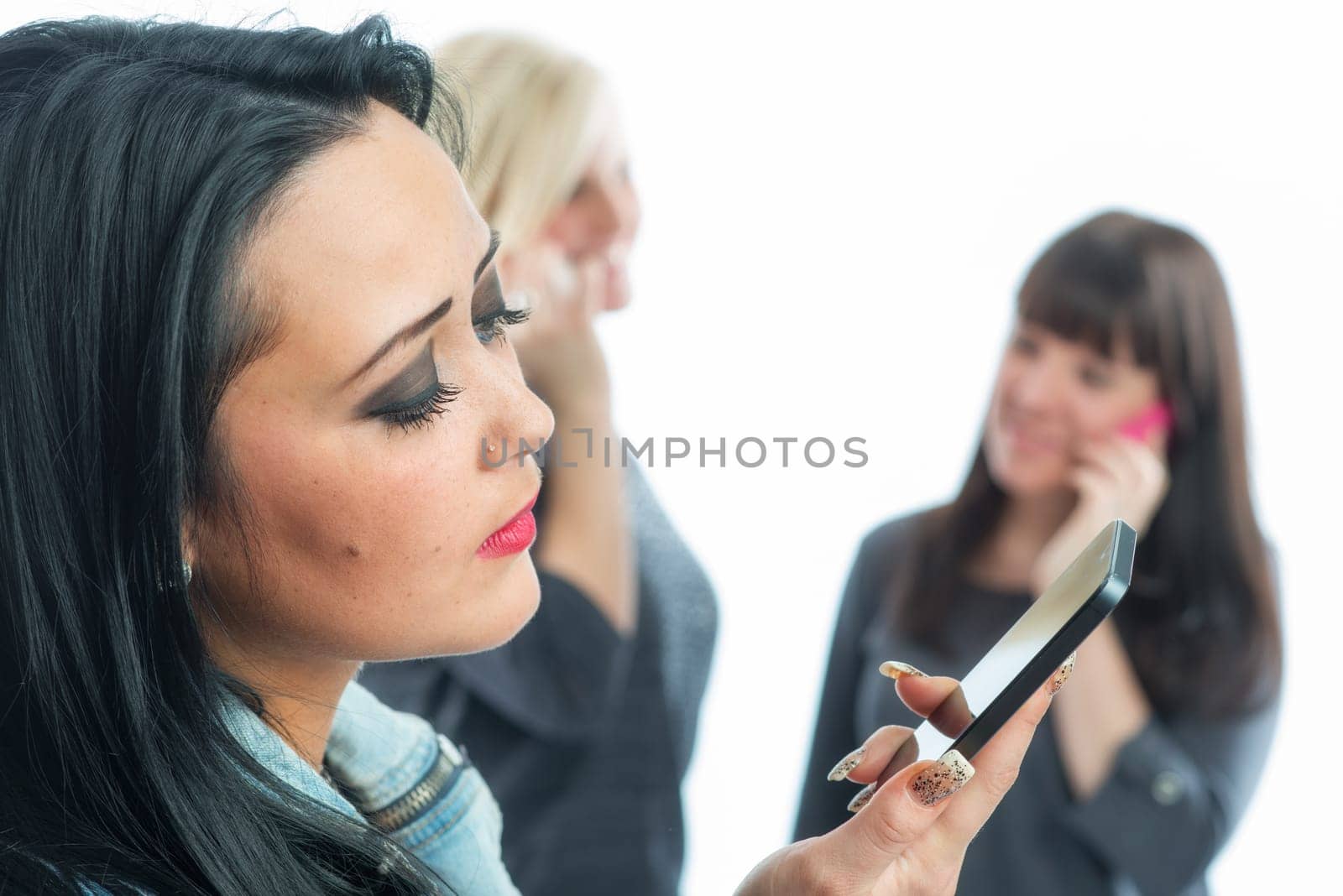 Three girls with smartphone