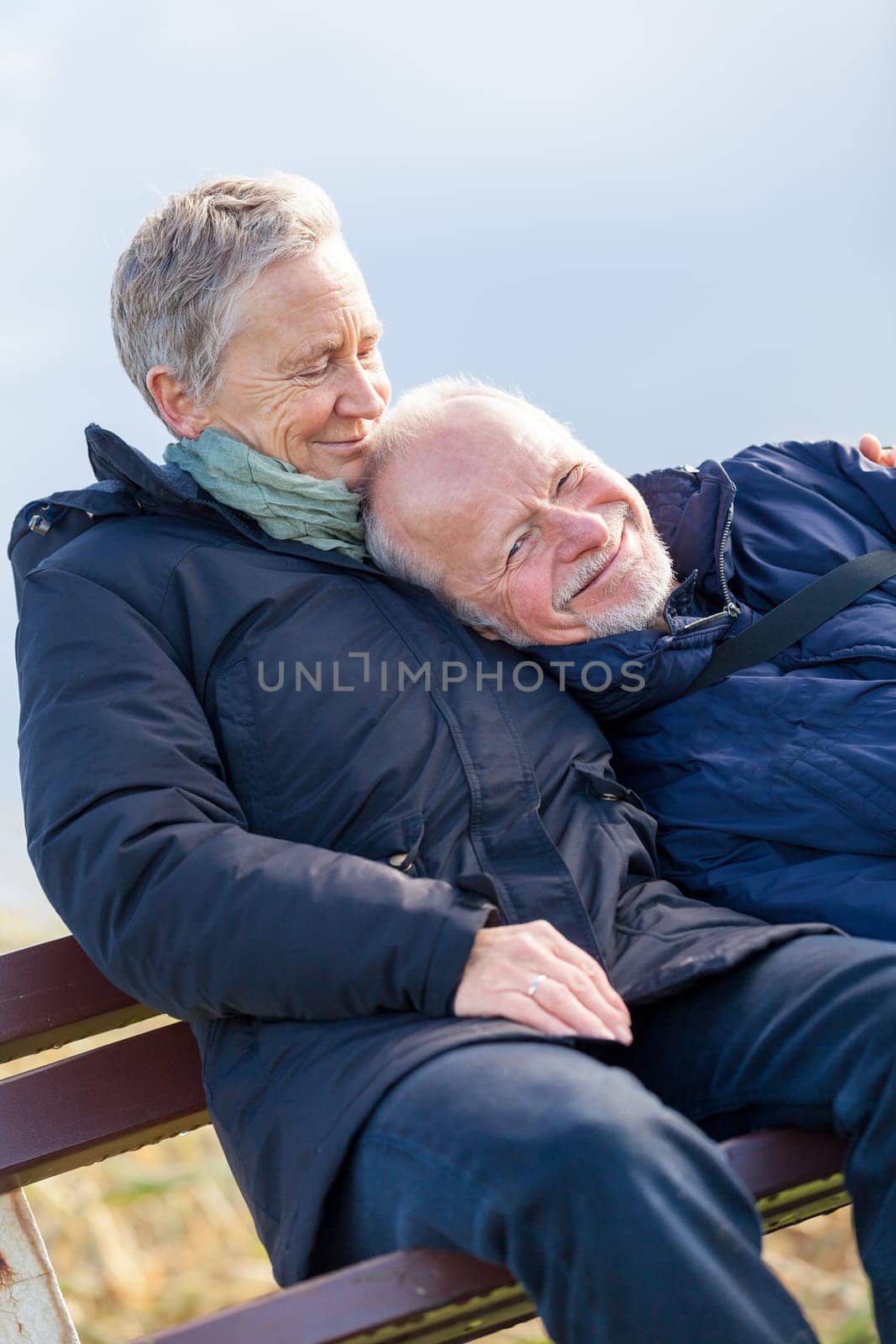 happy relaxed older couple out in the natural senior pensioner's leisure health old