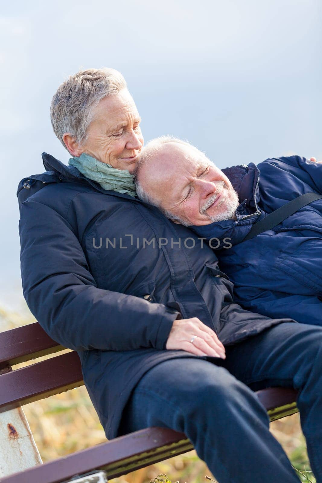 happy relaxed older couple out in the natural senior pensioner's leisure health old