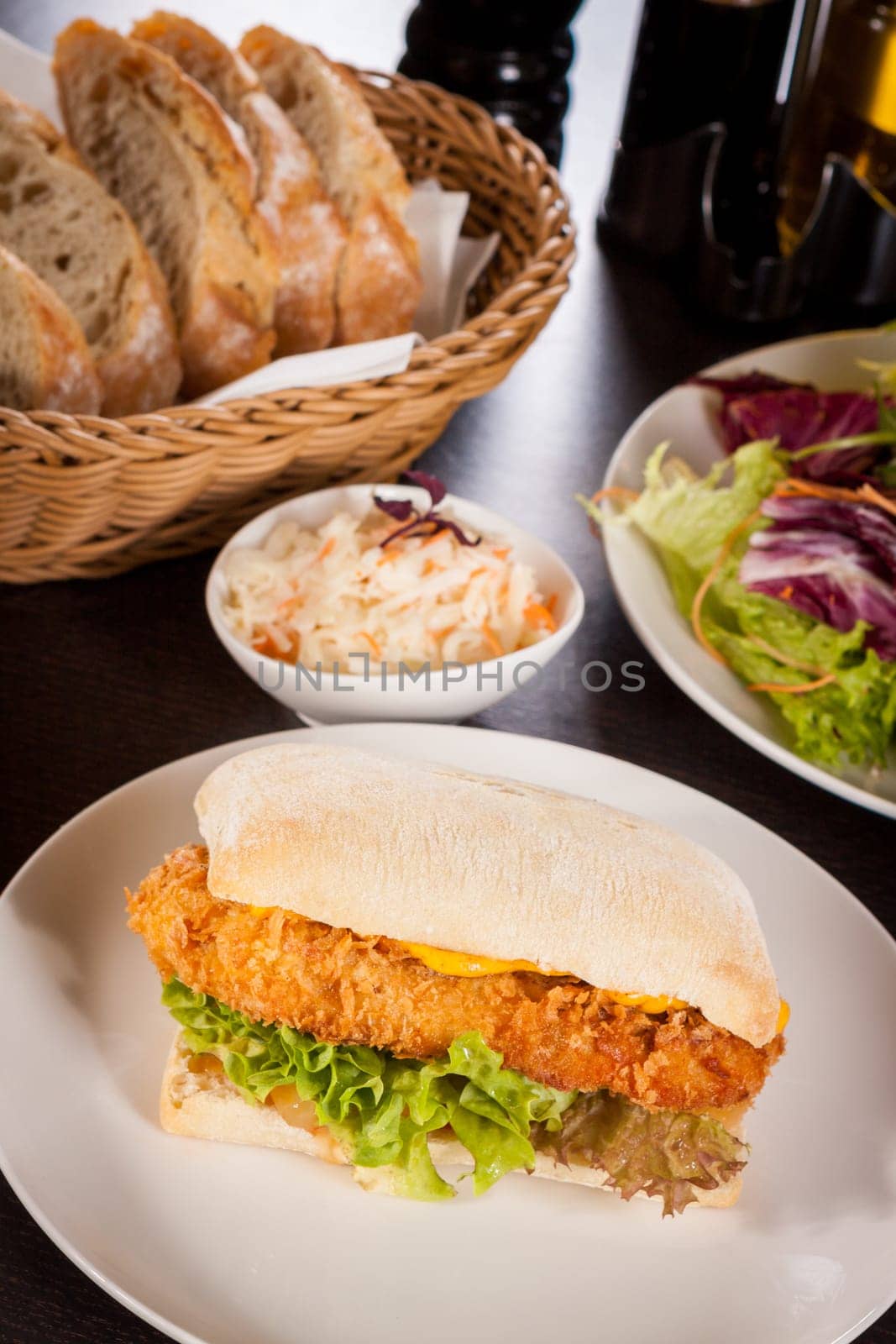 Chickenburger with chicken meat and salad as a close-up on a plate