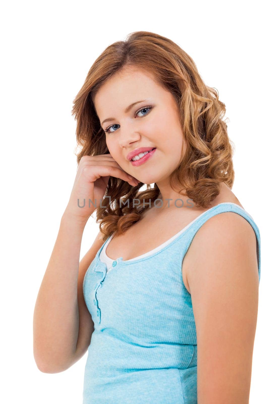Blonde girl teen with blue eyes and blue shirt laughing portrait isolated