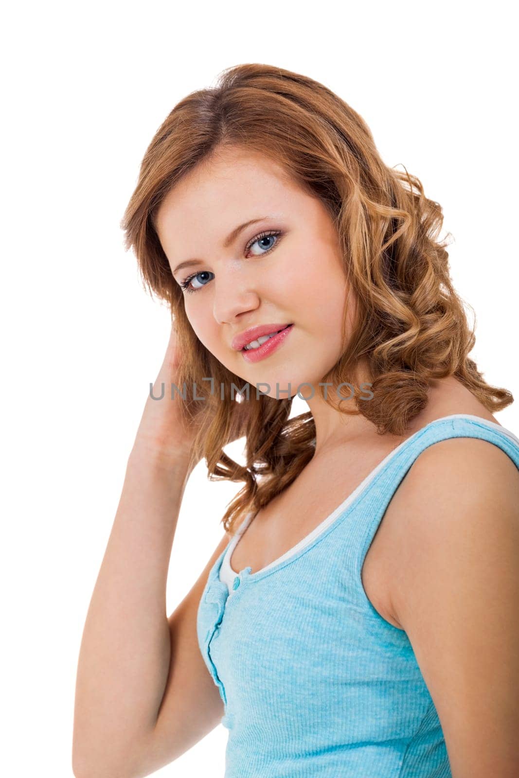 Blonde girl teen with blue eyes and blue shirt laughing portrait isolated