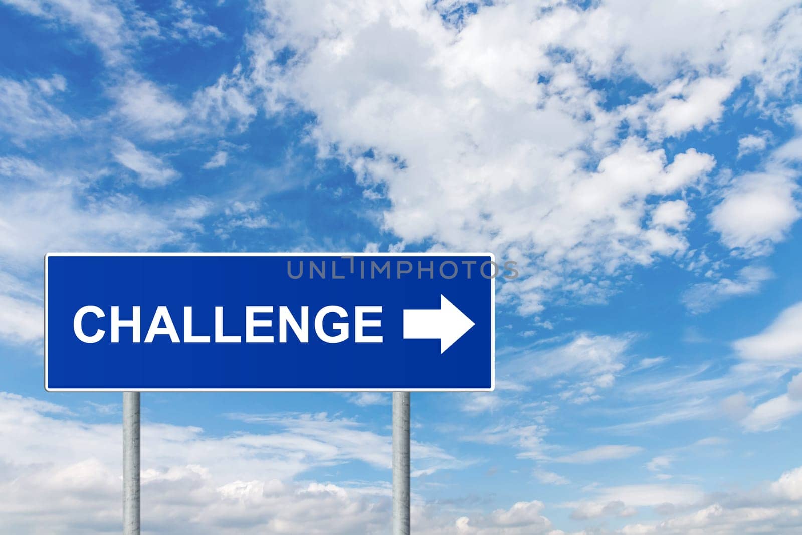challenge on blue road sign with blue sky