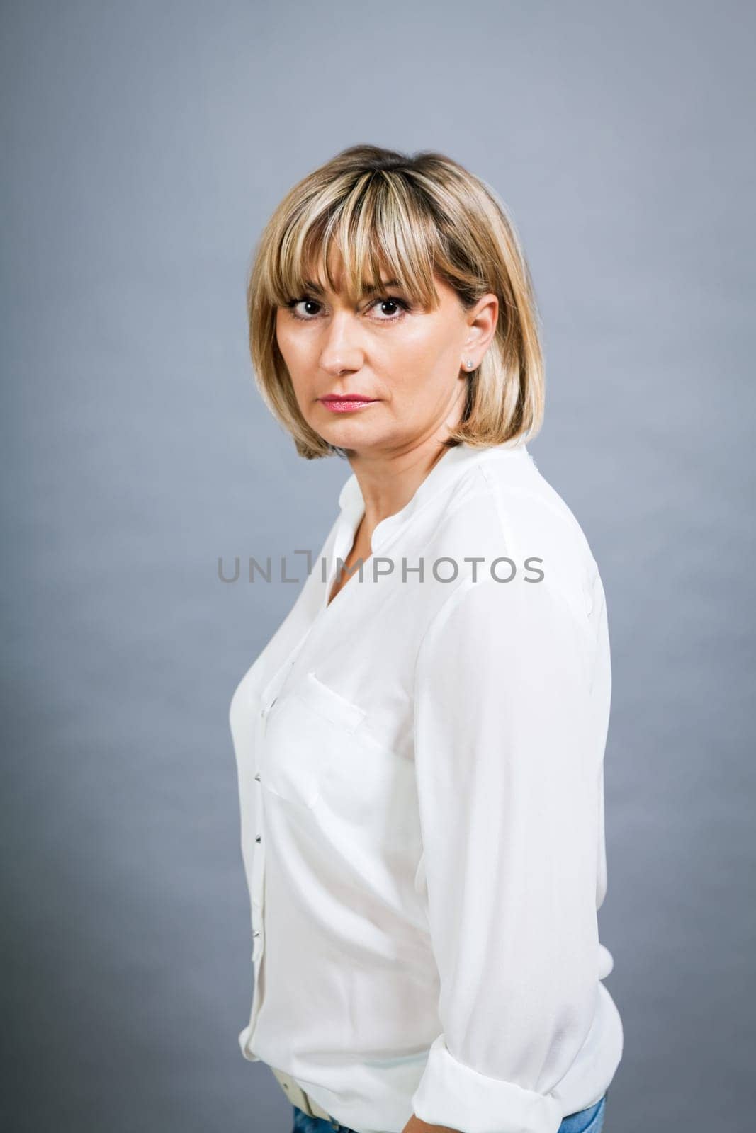 adult attractive woman in middle age portrait against gauem background