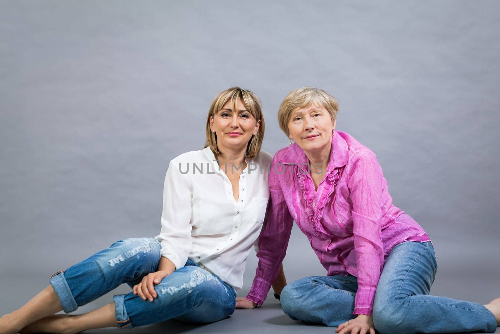 older adult happy wife mother with adult daughter portrait generation against grey background