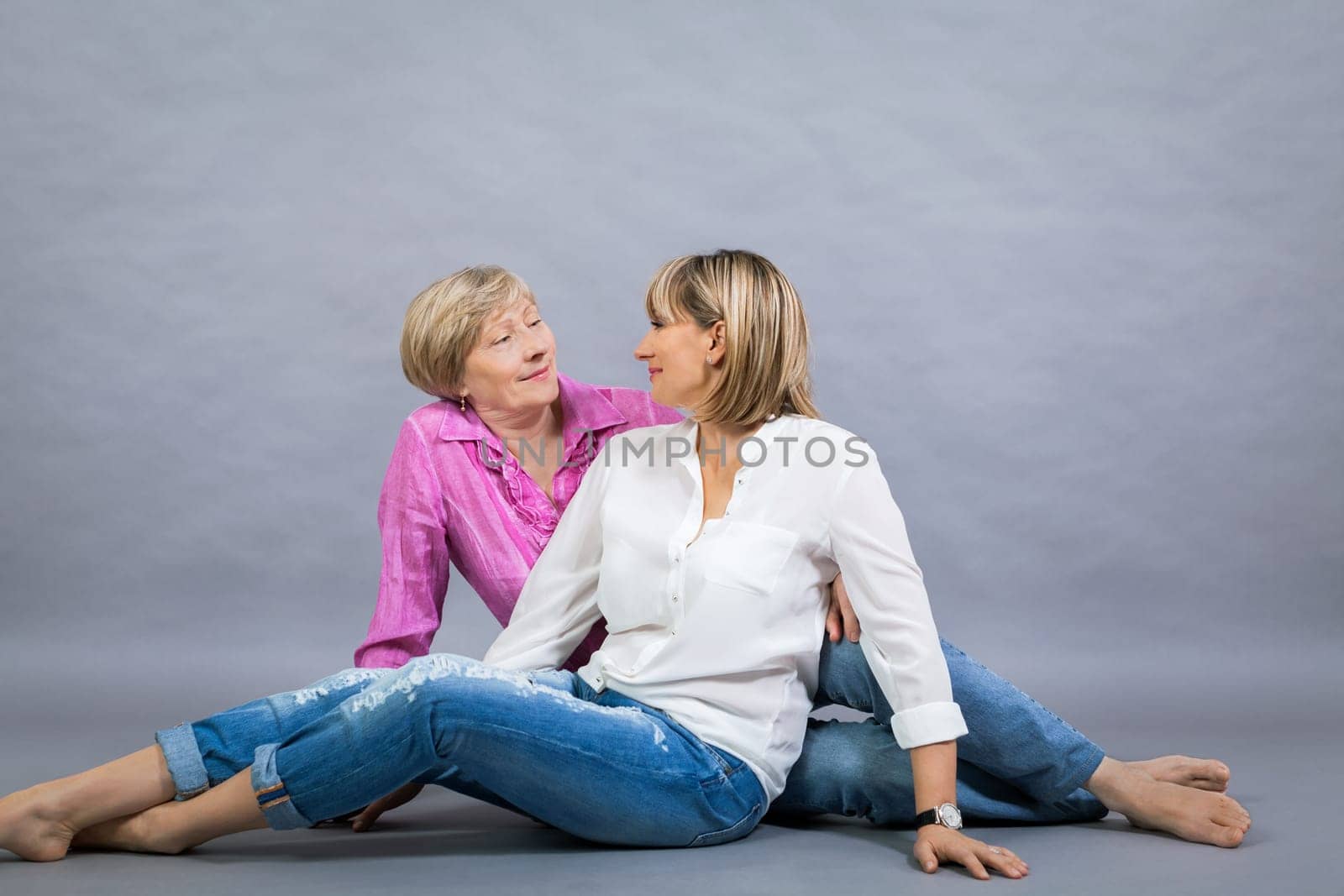 older adult happy wife mother with adult daughter portrait generation against grey background