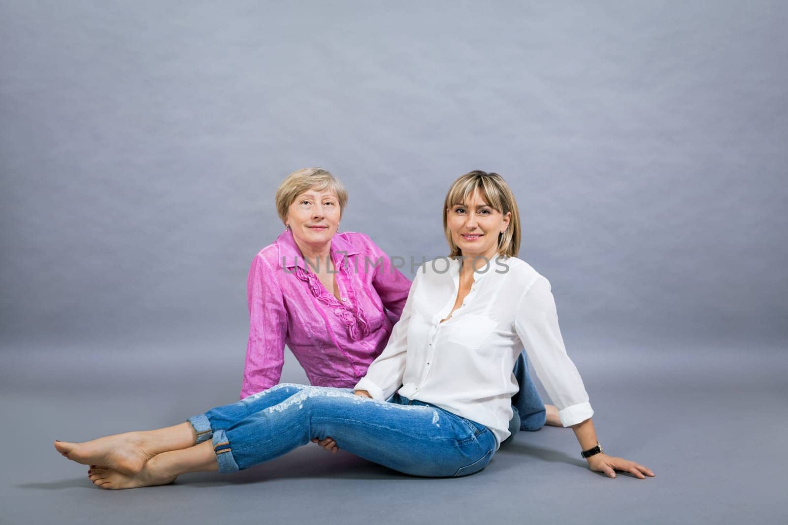 older adult happy wife mother with adult daughter portrait generation against grey background
