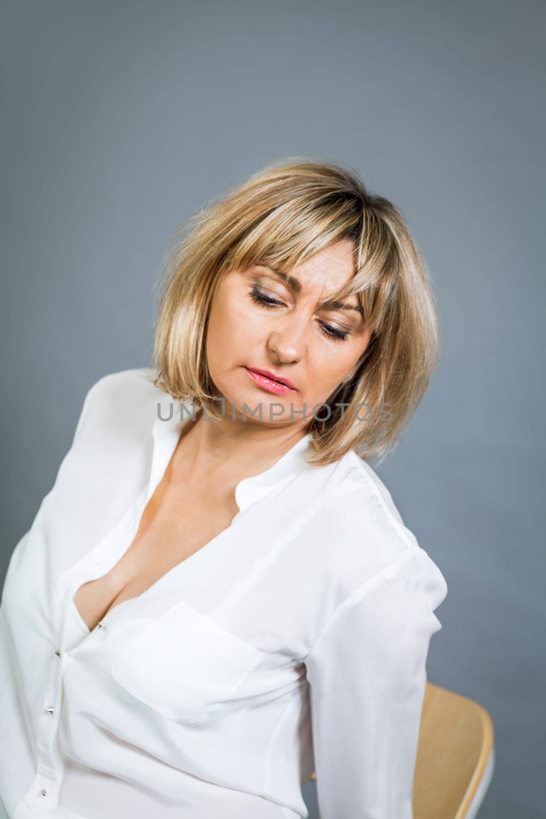 adult attractive woman in middle age portrait against gauem background
