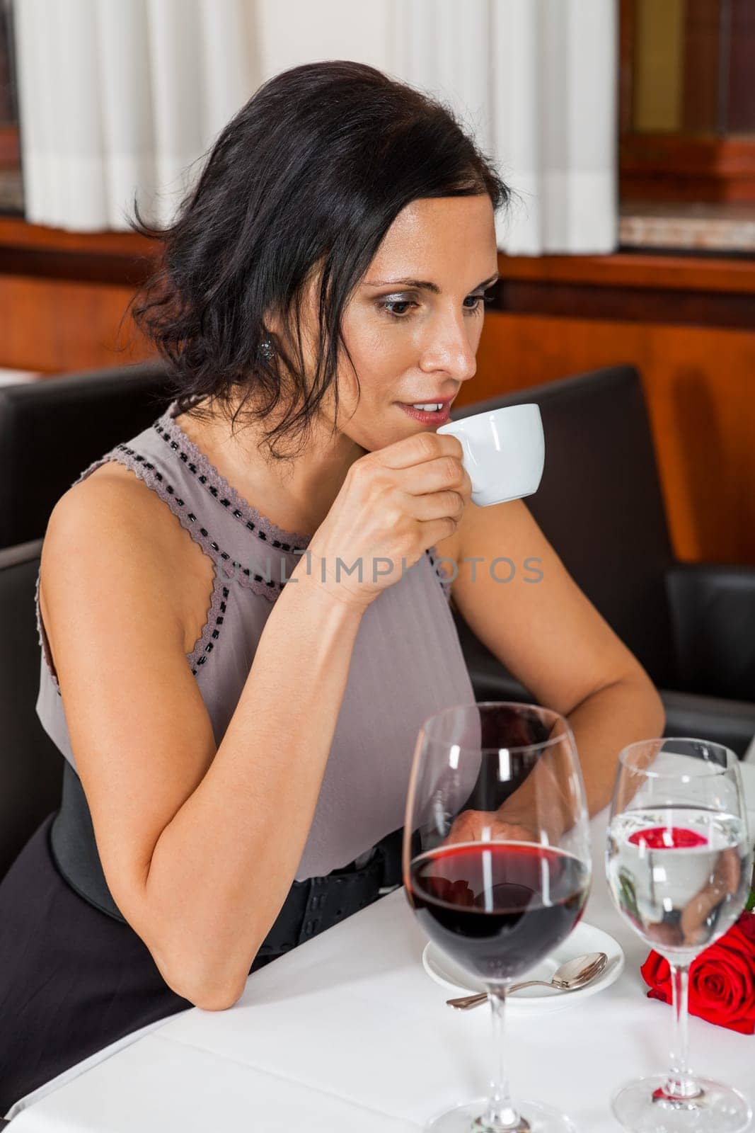 Young couple group in a restaurant cheerful while drinking