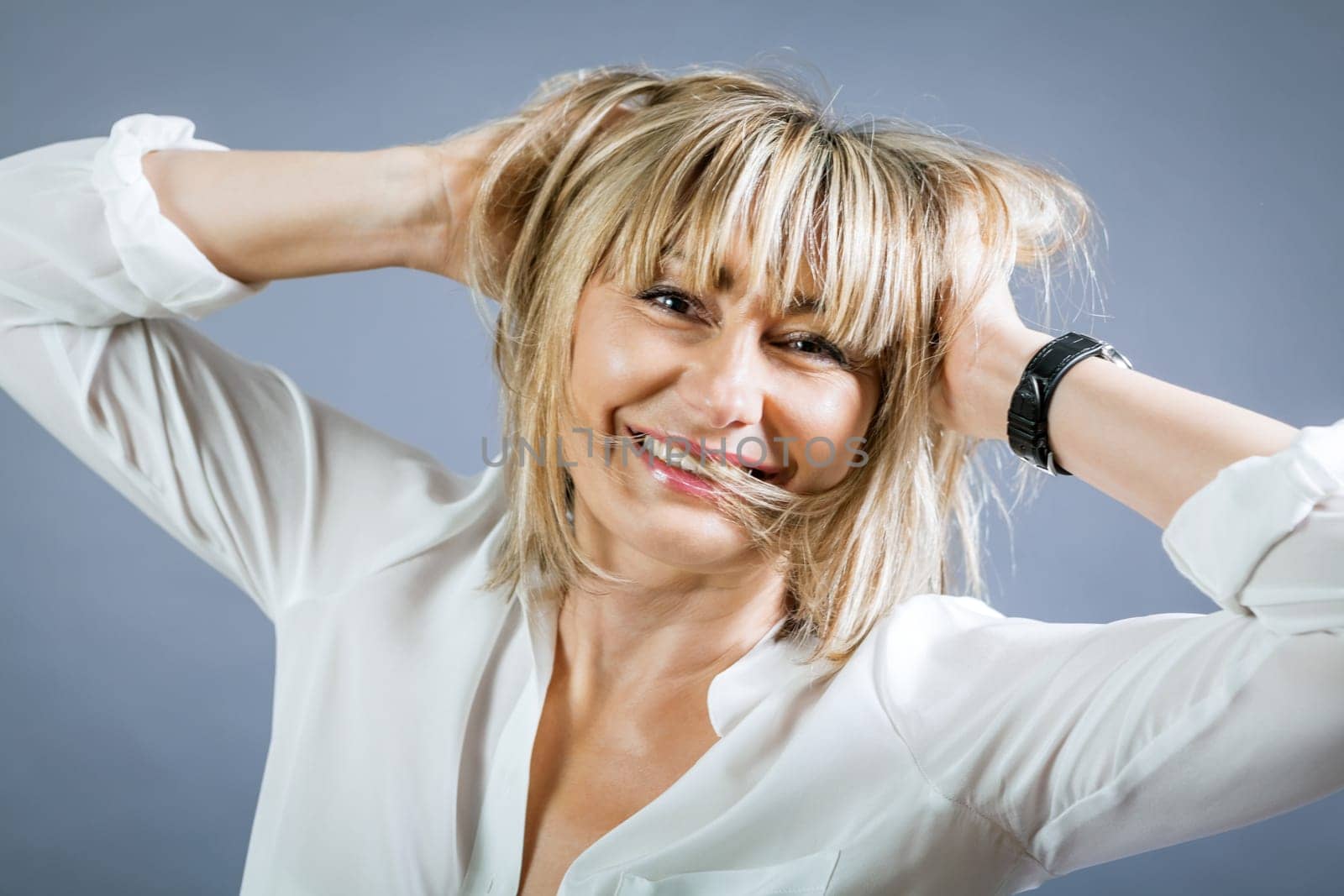 adult attractive woman in middle age portrait against gauem background