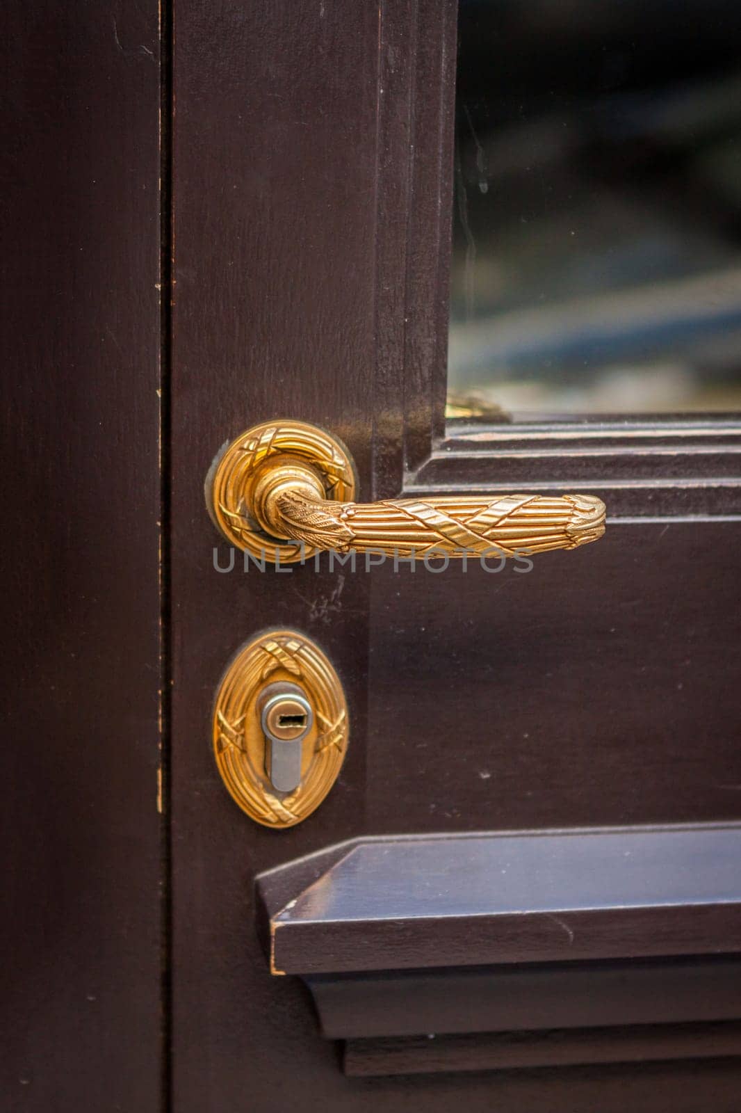 Doorknob doorknob on a wooden door entrance at a house as a close-up