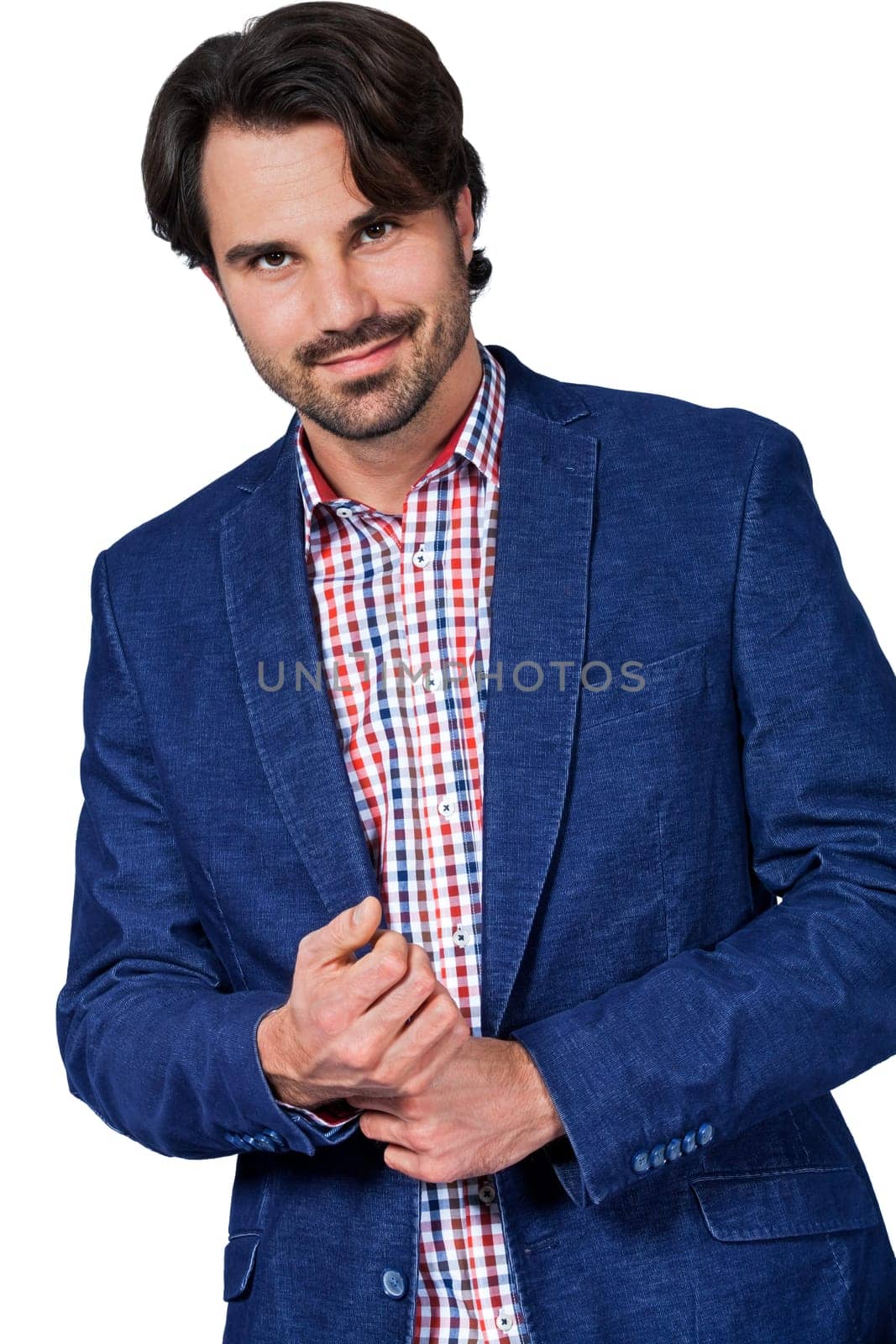 Young man in trendy casual look with dark hair and beard isolated against a white background