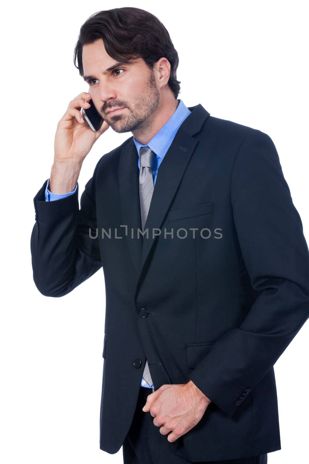 Young businessman with smartphone with dark hair and beard isolated against white background