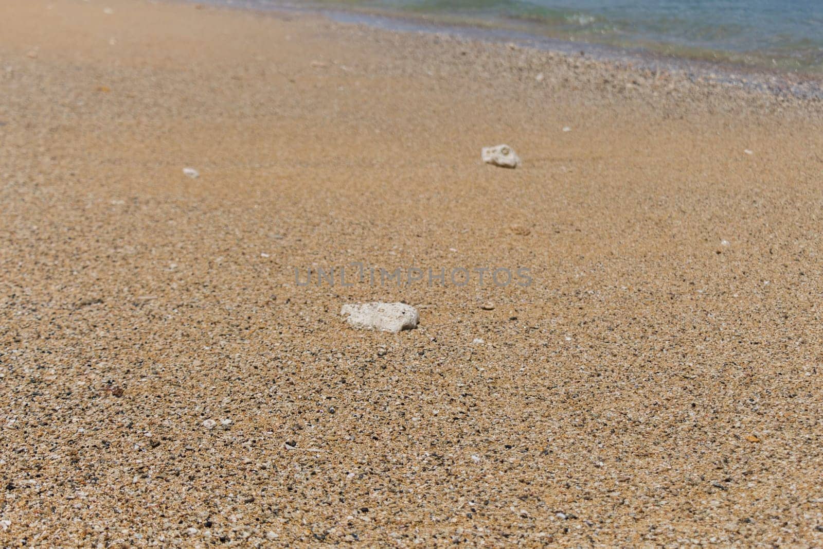 Sand gravel at the sea as a close-up as a background