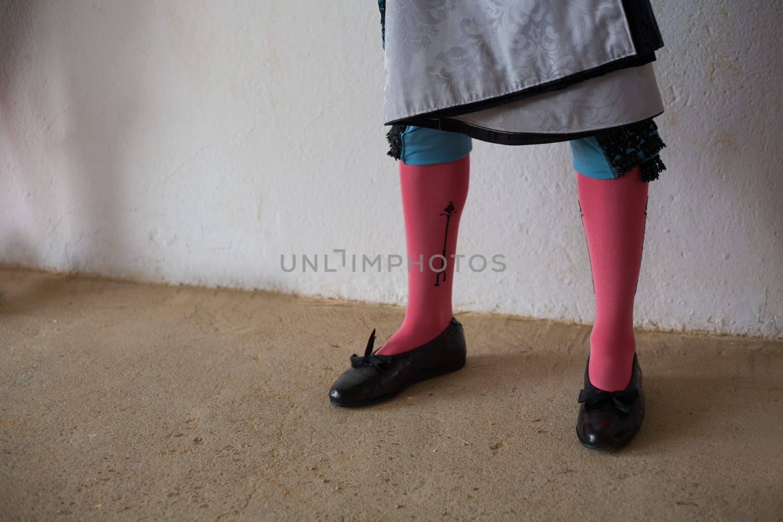 Legs of bullfighter waiting in the patio de cuadrillas, Badajoz, Spain.